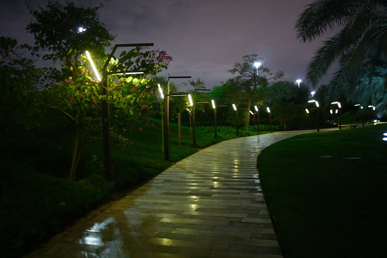 Pathway with modern lights and trees in Al Shaheed Park thumbnail